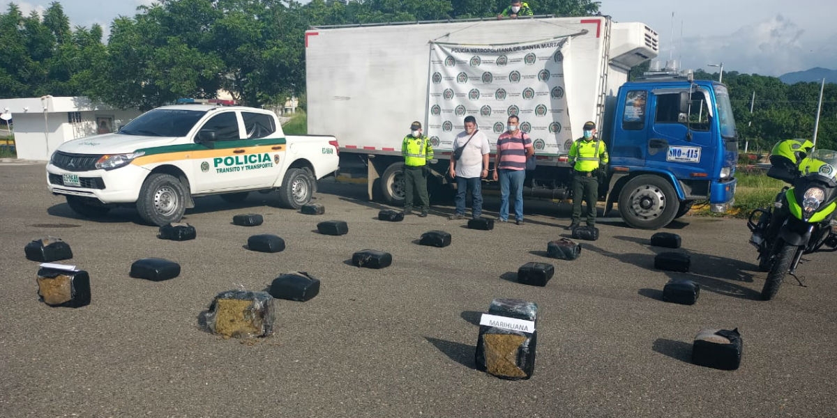 Policía Juan Manuel Serna y Rivelino Lozada.