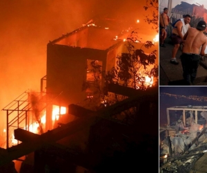  Varias personas intentan sofocar las llamas en sus viviendas que se han visto afectadas por un incendio forestal que alcanzó ayer en Valparaíso.